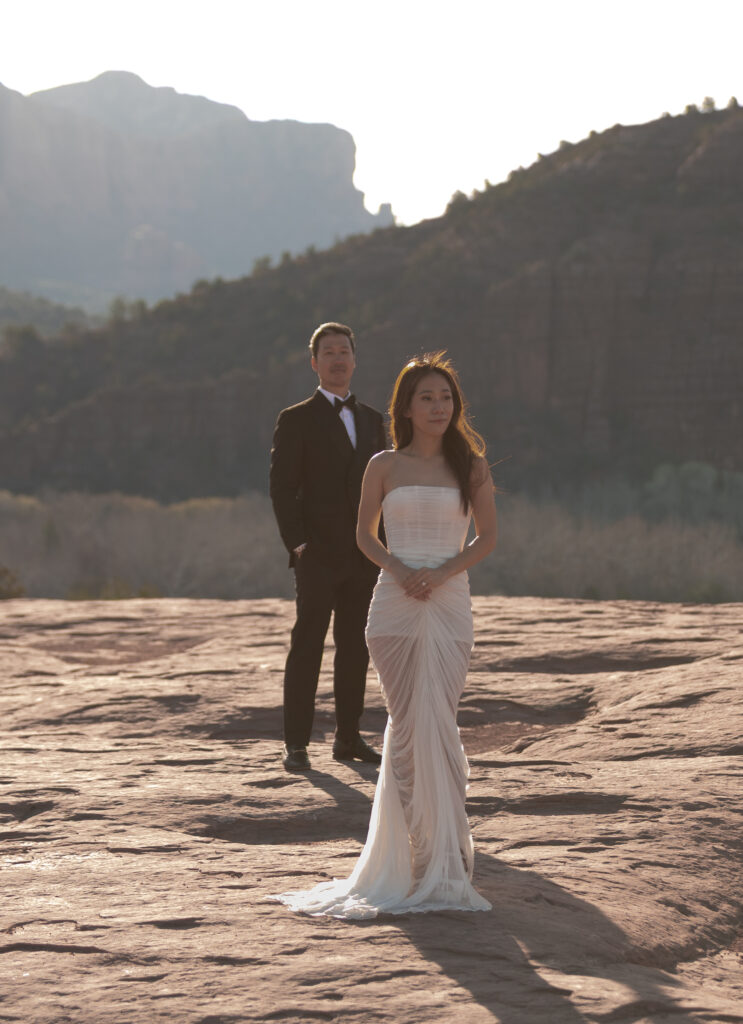 Kisses and laughter under an orange sky, with Cathedral Rock towering like a backdrop from a fairytale.