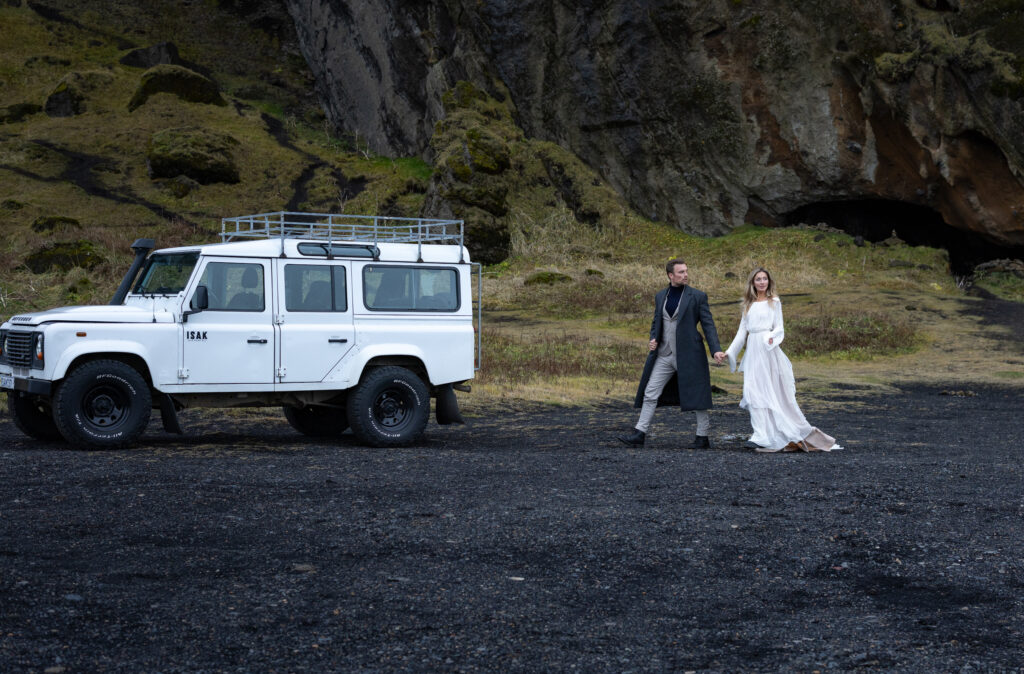 Iceland elopement photographer capturing bride and groom at Skógafoss waterfall