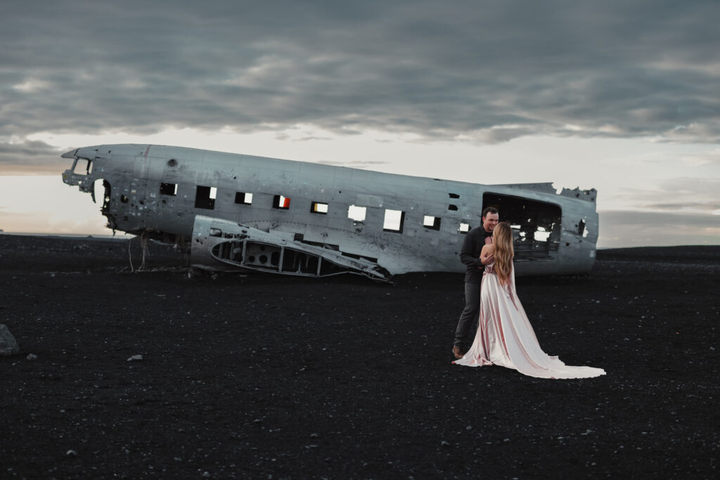 Bride and groom eloping at the Sólheimasandur plane wreck in South Iceland | Kollar Photography