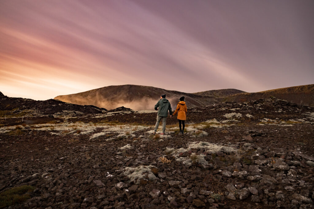 Couple hiking volcanic landscapes in South Iceland at sunset | Kollar Photography