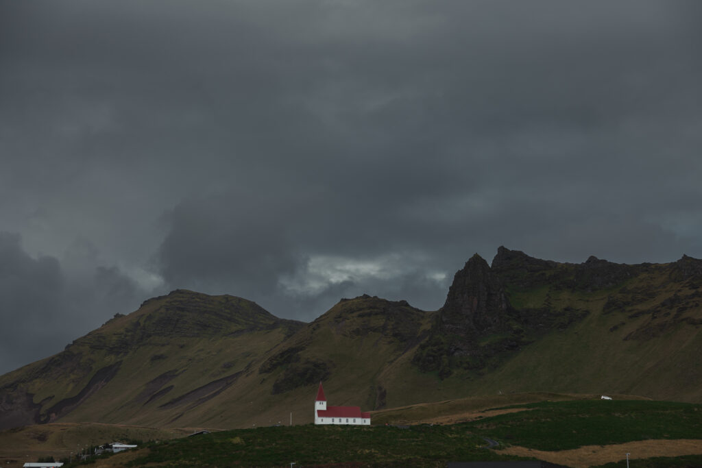 Scenic Iceland church with dramatic volcanic mountains | Kollar Photography