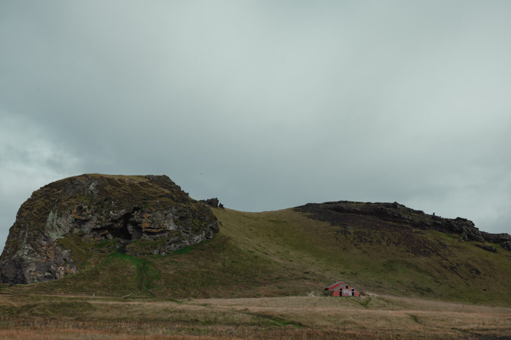 Green volcanic hills and farmland along Iceland’s South Coast | Kollar Photography